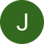 White letter J centered on a dark green circular background.